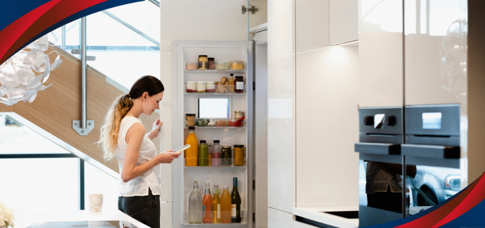 A Woman Looking Inside a Low-Priced LG Fridge