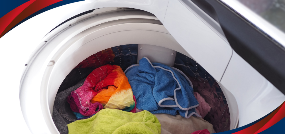 Clothes inside a washer tub illustrating American Home’s washing machine 10 kg-capacity model